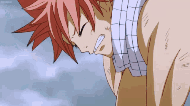 a man with red hair and a towel around his neck