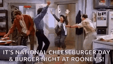 a group of people are dancing in a living room on national cheeseburger day .