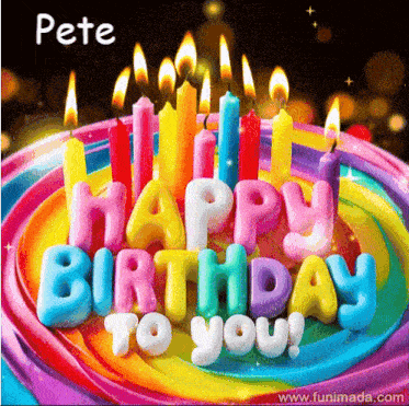 a colorful birthday cake with candles and the words happy birthday to you