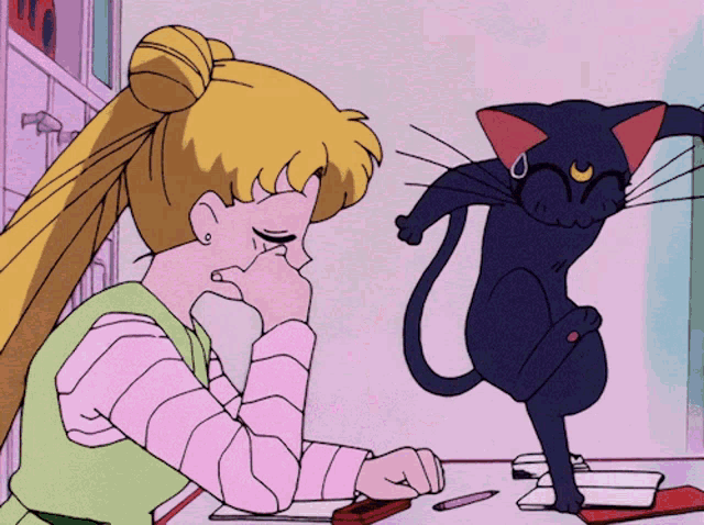 a girl sitting at a desk with a black cat behind her