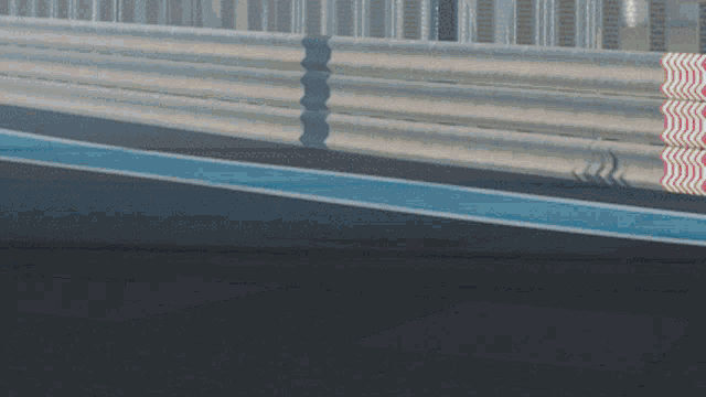 a race track with a blue line on the right