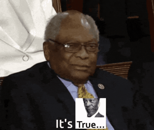 a man in a suit and tie is holding a picture of a man with the words " it 's true " below him