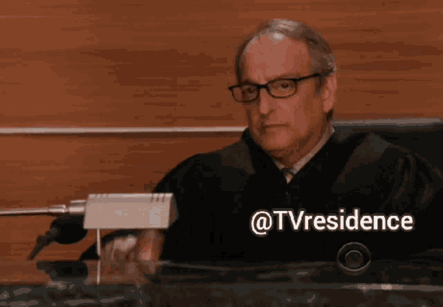 a judge in a courtroom with the words shut up everyone written above him