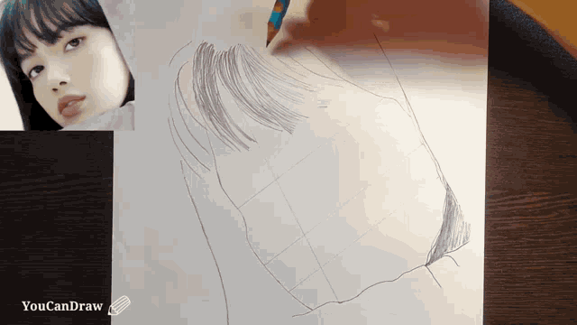 a drawing of a woman 's face is on a piece of paper that says you can draw