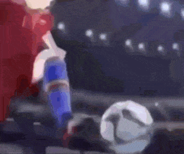 a blurry picture of a person playing a game of soccer