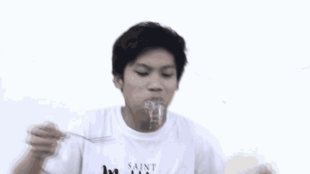 a man wearing a white shirt that says matthew is being sprayed with water