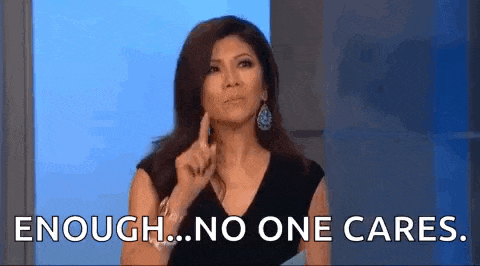 a woman is making a funny face and pointing her finger at the camera while saying `` enough ... no one cares . ''