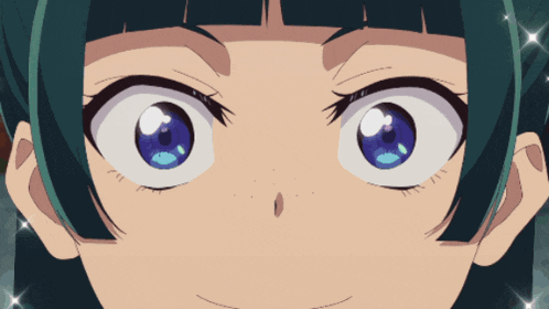 a close up of a girl 's face with blue eyes and green hair