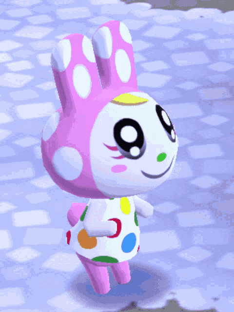 a pink and white bunny with polka dots on it