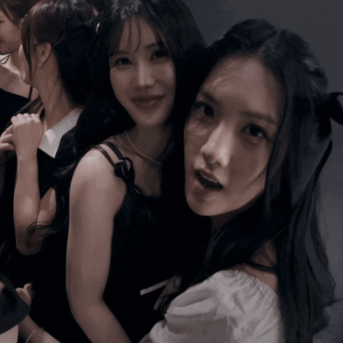 a group of young women are posing for a photo together