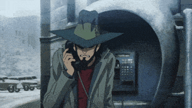 a man with a beard is talking on a phone