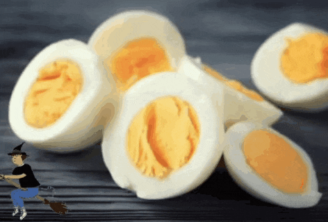 a cartoon of a witch standing next to hard boiled eggs
