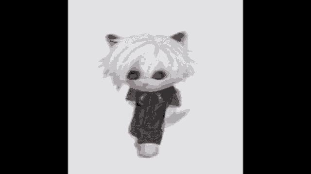 a stuffed animal with white hair and a black shirt