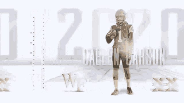 a football player with the number 1 on his jersey stands in front of a sign that says 2020