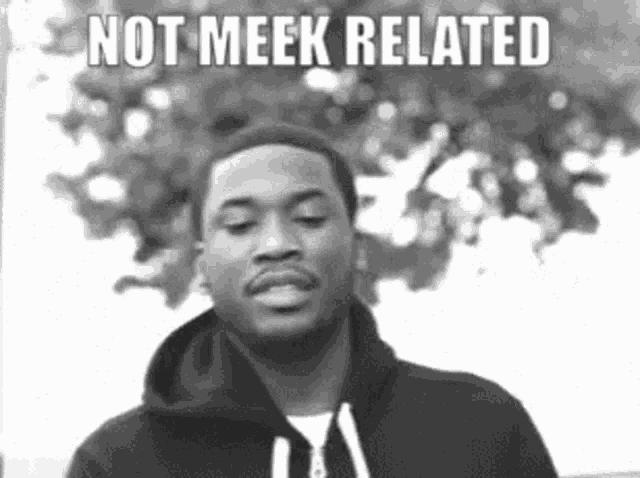 a black and white photo of a man with the words not meek related written above him