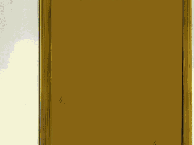 a cartoon character is peeking out of a brown door