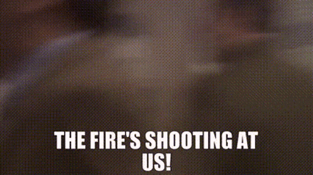 a man standing in front of a green exit sign with the words the fire 's shooting at us .