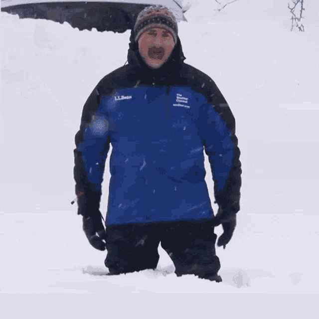 a man in a blue jacket is kneeling in the snow with the words " i 've had i " above him