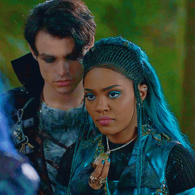 a man and a woman standing next to each other
