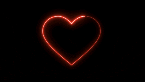 a neon heart with the words happy valentine 's day on it
