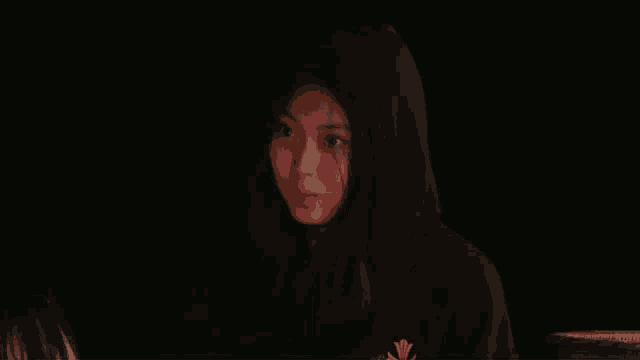 a woman in a black hoodie with the words personality wise written below her
