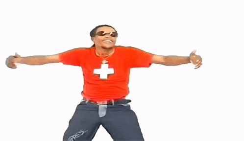 a man wearing a red shirt with a cross on it
