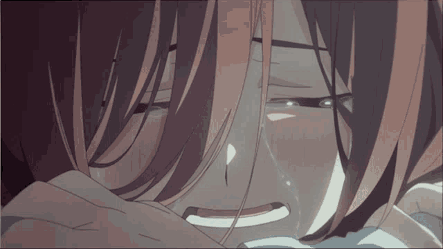 a close up of a person 's face with tears coming out of their eyes