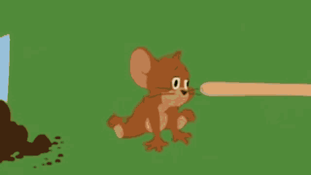 a cartoon mouse is holding a stick in its mouth while sitting on the grass .