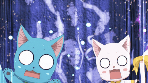 a blue cat and a white cat are looking surprised