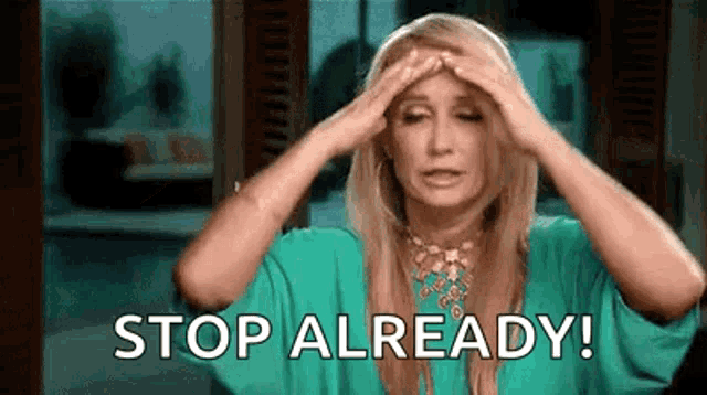 a woman in a green shirt is holding her head and saying `` stop already '' .