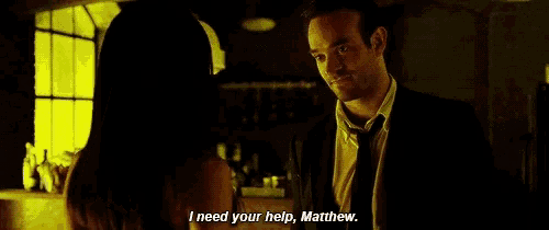 a man and a woman are standing next to each other and the woman says i need your help matthew .