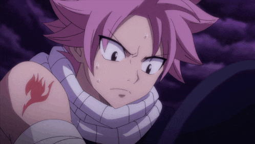 a person with pink hair has a tattoo of a fairy tail on their arm