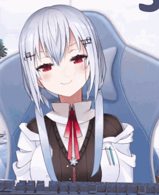 a girl with white hair and red eyes is sitting in a chair