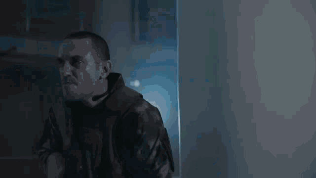 a man is standing on a set of stairs holding a flashlight