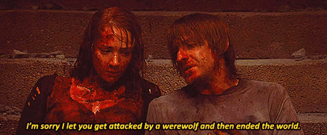 a man and a woman with blood on their faces are sitting next to each other and the man says i 'm sorry