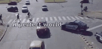 a perfect world is written on the bottom of a busy intersection