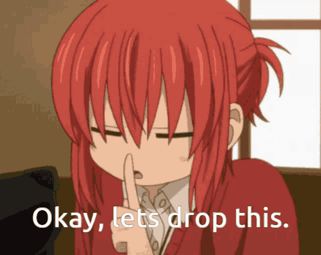 a girl with red hair is holding her finger to her lips and says okay lets drop this