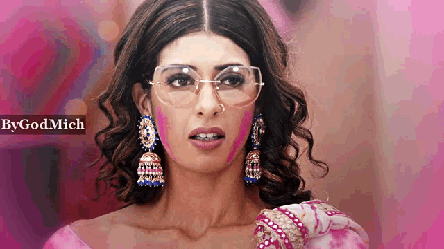 a woman wearing glasses and earrings with the word bygodmich in the upper right corner