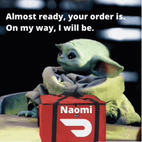 a baby yoda with a red bag that says naomi on it