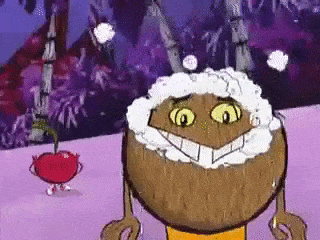a cartoon character is standing next to a cherry .