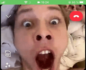 a man is making a funny face while talking on a video call