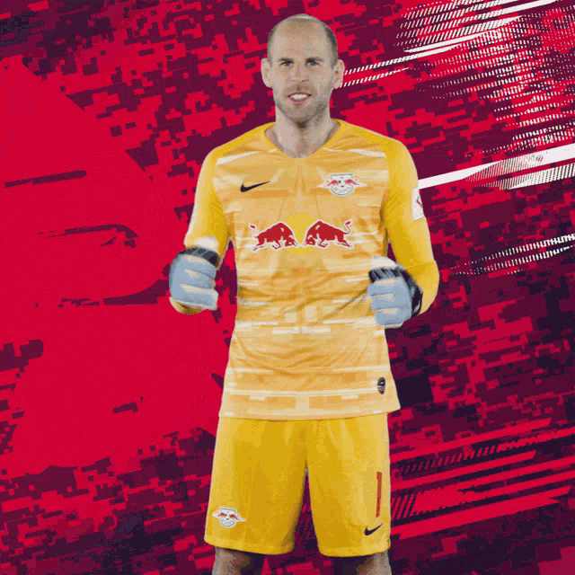 a soccer player with a red bull on his jersey