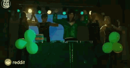 a man and a woman are dancing in front of a reddit sign