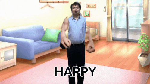 a man standing in a living room with the word happy written on the floor