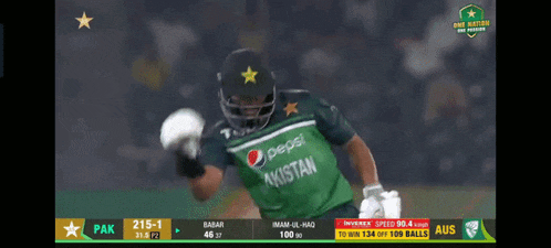 a man in a green pepsi pakistan jersey is playing cricket