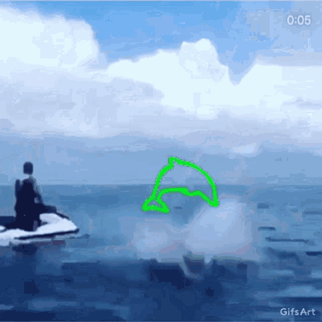 a man on a jet ski in the ocean with a green dolphin drawn in the water