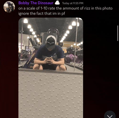 a picture of a man sitting in front of a mirror with the caption bobby the dinosaur