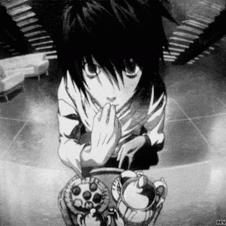 a black and white photo of a boy sitting at a table with a teapot and a cake .