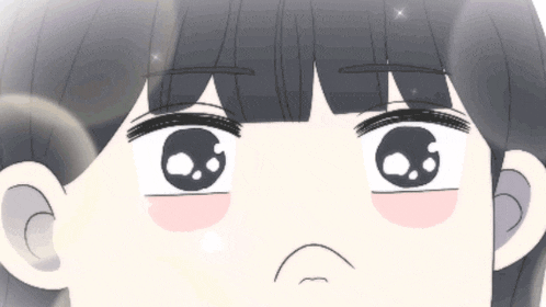 a close up of a cartoon girl 's eyes with a sad look on her face .