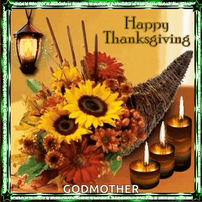 a cornucopia filled with flowers and candles with the words `` happy thanksgiving godmother '' written on it .